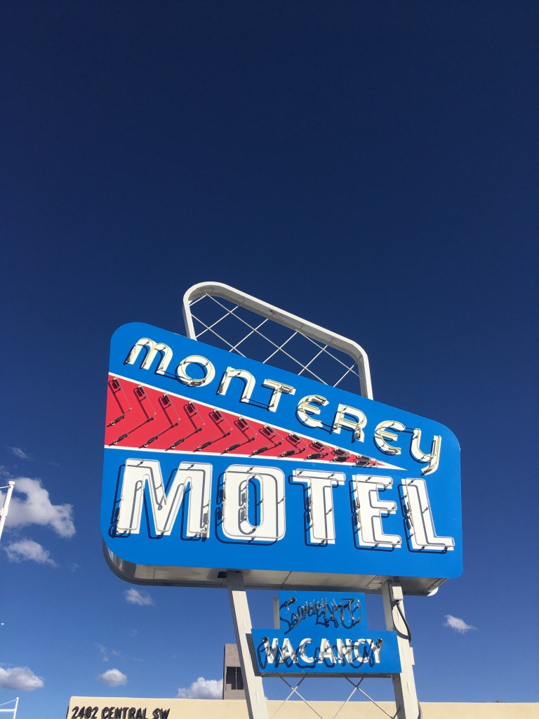photo of the Monterey Motel sign against a bright blue sky