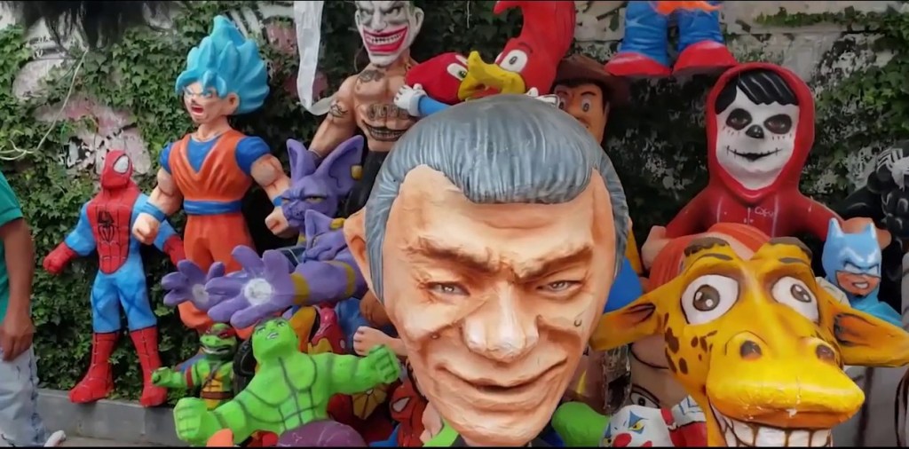 photo of papier mache heads on life-size dolls